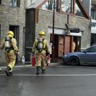 Queenstown fire volunteers approach Halo cafe in central Queenstown yesterday. Photo: David Williams