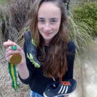 Wanaka runner Sammy Burke (18) with the gold medal she won at the Australian secondary schools...