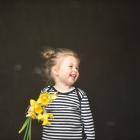 Emily McAndrew (2), of Dunedin, holds a bunch of daffodils bought to support Daffodil Day in...