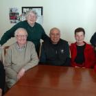 Daffodil House manager Sandra Wilson (left) relaxes in the dining room with a group of house...