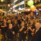 Dressed to support... Rugby fans celebrate the All Blacks' win in the Octagon tent village after...