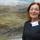 Bannockburn artist Gail de Jong with her prizewinning painting Carrick Water Race, at Saturday’s...