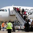 Passengers board a flight at Benina airport east of Benghazi in Libya. Photo: Reuters