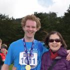 Damian Hill and mother Denise Hill, both of Dunedin, at the finish of the half-marathon. Photo:...