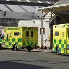 Ambulances wait outside a warehouse in Willis St where a woman was injured in a workplace...