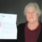 Carol Bryan, of Oamaru, holds a letter from the Southern District Health Board advising her that...
