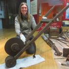 North Otago Museum curator Chloe Searle holds one of the mystery items. Photo: Shannon Gillies.