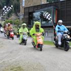Participants in the scooter charity ride arrive at the Queenstown Rec Grounds on Saturday. Photo:...