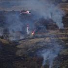 One of three helicopters that fought a burn-off between State Highway 6 and the Remarkables...