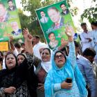 Supporters of Pakistan's former Prime Minister Nawaz Sharif chant slogans during his appearance...