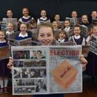 St Bernadette’s School pupil Ruby de Graaf (10) reads a special election lift-out in yesterday’s...