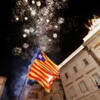 Fireworks go off in front of the Catalan regional government headquarters during celebrations...