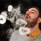 Dunedin e-cigarette store Vapourium account manager Cody Peneamene blows vapour rings from a...