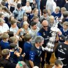 America's Cup minder Norman Newton is surrounded by pupils wanting one last glimpse and, if they...