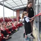 One of Fairfield School oldest pupils, Mikayla Preston and the school's youngest, Calla Weir, cut...