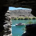 The Clutha River at Roxburgh as seen from a gold miner’s hut built under a rock. In Central Otago...