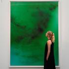 An employee poses next to 'Frieschwimmer 193' by Wolfgang Tillmans, at Sotheby's in London. Photo...