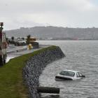 A car crashed into Otago Harbour this afternoon. Photo: Gregor Richardson