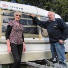 Winton couple Mary and Keith Cooper stand in front of their damaged caravan in Alexandra...