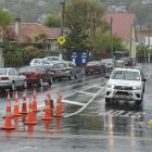 Cones are in place at a Caversham intersection on Monday  after a traffic island was ripped out....