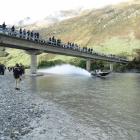 Spectators watch as Gareth Munro (Christchurch) speeds under a bridge over the Dart River near Glenorchy in his A class boat on Saturday. Photos: Paul Taylor.