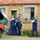 Police at the scene in Seacliff in March last year. Photo: Stephen Jaquiery