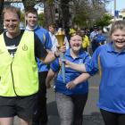 Senior Sergeant James Ure and Britney Kerr carry the Special Olympics Flame of Hope through...