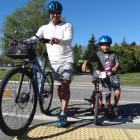Crossing Ballantyne Rd are George and Noah (6) Konia so they can continue riding on the cycle and...