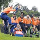 Otago Polytechnic student Mason Lee (17) gives the go signal for grass kart drivers (from left)...