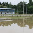 Floodwater sits on the Roxburgh Golf Course in front of the Roxburgh sports pavilion. Photo:...