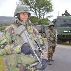 Soldiers patrol a checkpoint in Inverness St, Dunollie, outside O'Brien Park this morning as...