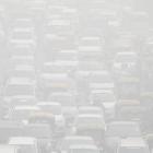 Vehicles drive through heavy smog in Delhi. Photo: Reuters
