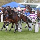 Titan Banner and driver Dexter Dunn (purple and white) are about to repel the challenge of Dream...