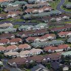 A view of suburban housing south of Auckland.  Photo by The New Zealand Herald.