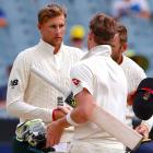 England's captain Joe Root shakes hands with Australia's captain Steve Smith to end the fourth...