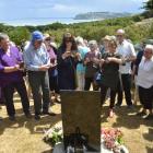 Relatives of those killed at the Seacliff Lunatic Asylum fire of 1942 view a  plaque unveiled on...