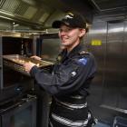 Able Chef Rianna Palmer, of Mosgiel, at work in the galley of HMNZS Otago which leaves the Birch...
