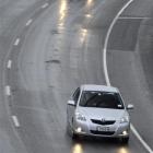 Motorists negotiate broken tarseal on the Southern Motorway, near Green Island. Photo by Matthew...