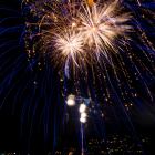 A huge fireworks display lights up Queenstown Bay just after the countdown to New Year’s Day....