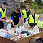 Collecting donated items during  the Mosgiel foodbank drive are (from left) Miciah Nicholl (15),...