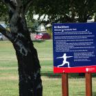 QLDC hopes signs will deter slackliners from using young trees in Wanaka's Pembroke Park. Photo:...