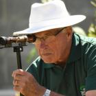 Bowls umpire Colin McKenzie uses a boundary scope at the Kaikorai greens during the national...