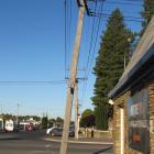A power pole  at the corner of Centennial Ave and Shannon St in Alexandra stands on an angle....