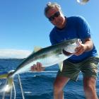 Karitane commercial fisherman Allan Anderson with one of many kingfish he has caught off the...