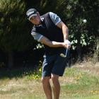 Blake Mason, of Wanaka, plays a chip shot on the 14th fairway in the first stage of qualifying...