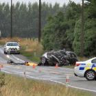 Police work at the scene of a fatal two-car crash about 1km north of Glenavy yesterday. Photo: Hamish MacLean
