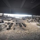 Burnt cars are seen in what remains of the multi-storey car park, where a large fire destroyed...