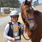 Junior driver Charlotte Purvis  holds the Cromwell Cup she won with Four Starzzz Shiraz  at...