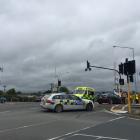 Emergency services attend a crash in Mosgiel where the vehicle ended up on train tracks. Photo:...