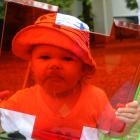 Millie Walters (19 months) has fun with a red filter and other pieces of science-themed...